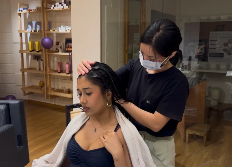 Client enjoying a hair spa treatment